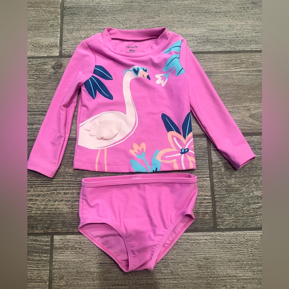 Carter’s baby girl swimsuit in like new condition.